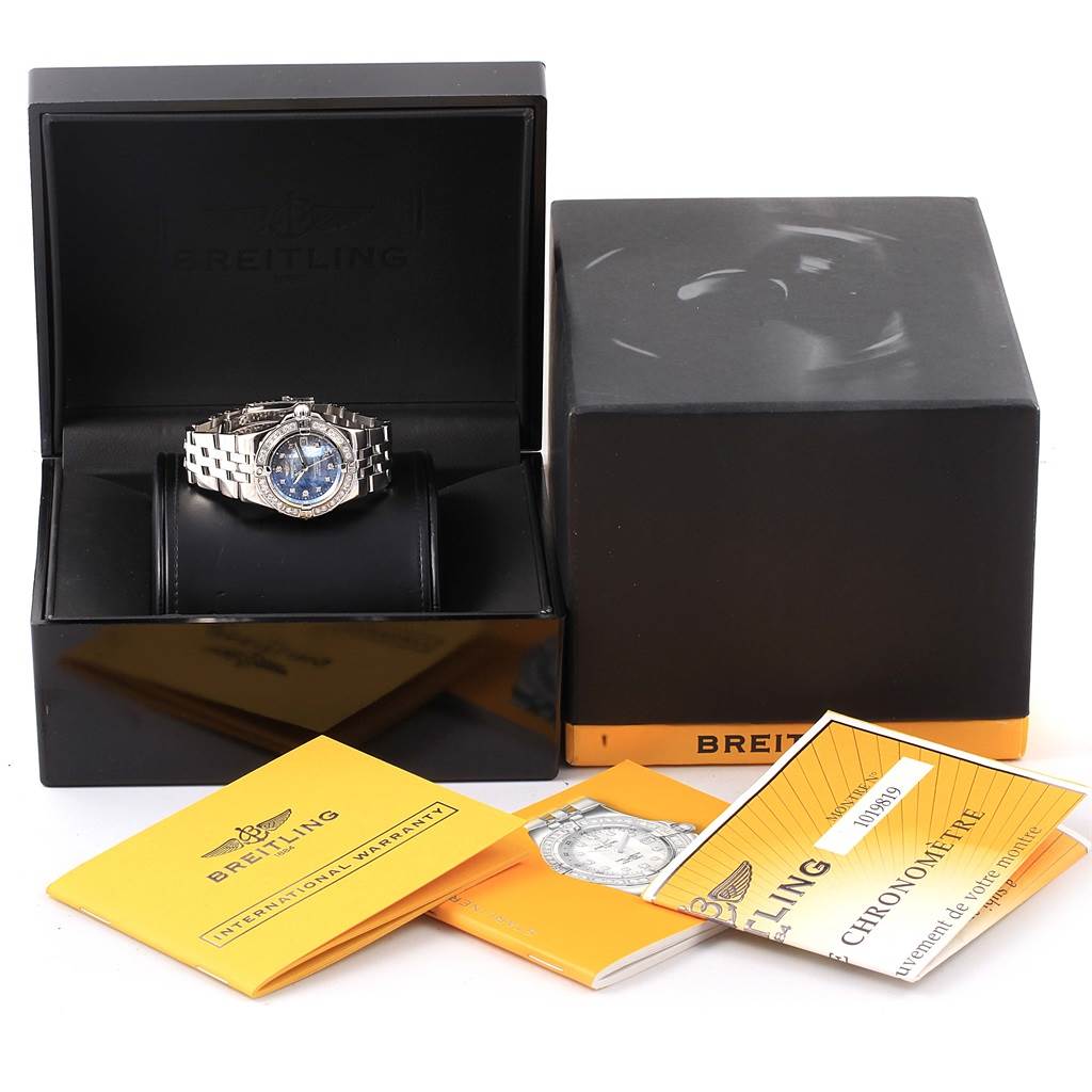 The image shows the Breitling A71340 Women's Stainless Steel Mother of Pearl Dial A71340 Women's Stainless Steel Mother of Pearl Dial Starliner Blue Mother of Pearl Diamond Watch A71340 with its original box, papers, and accessories.