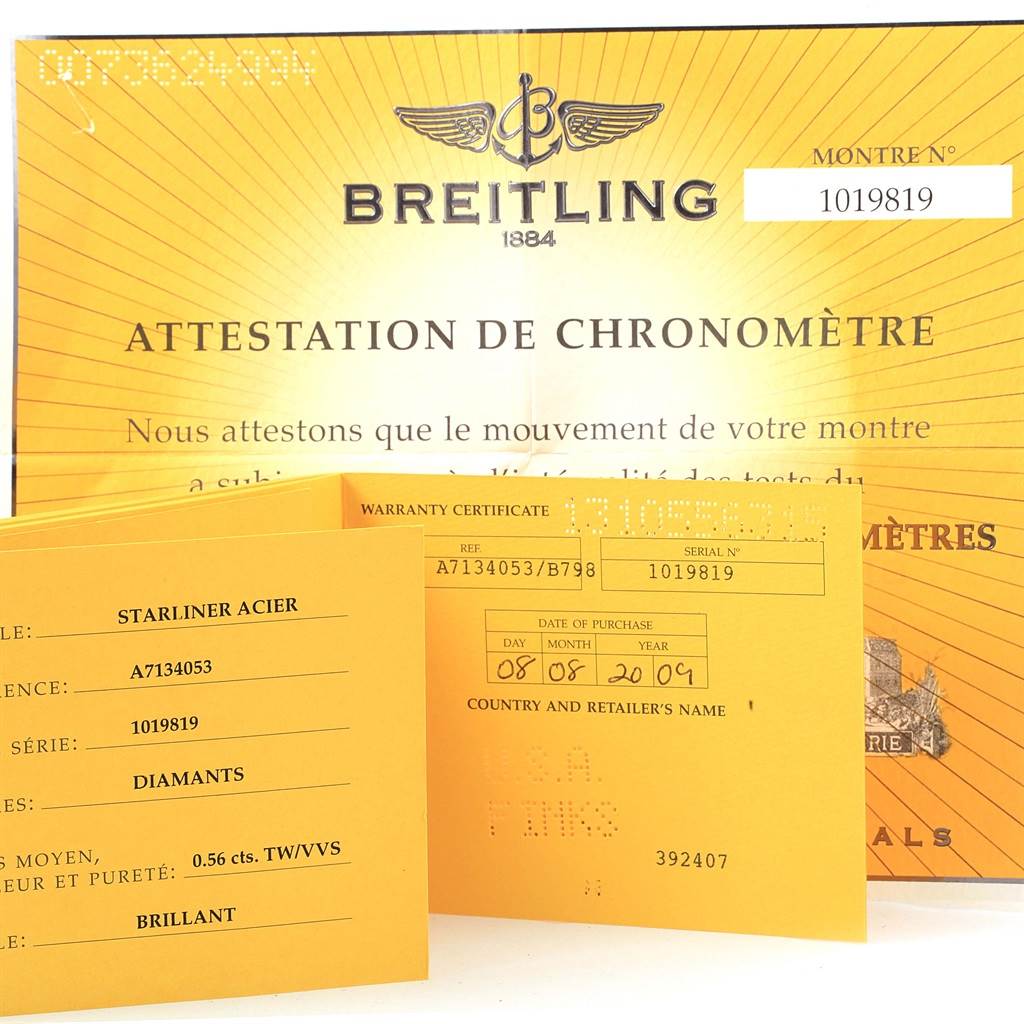 The image shows the box, papers, certificate, and warranty card for a Breitling A71340 Women's Stainless Steel Mother of Pearl Dial A71340 Women's Stainless Steel Mother of Pearl Dial Starliner Blue Mother of Pearl Diamond Watch A71340.