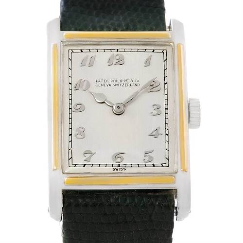 The image shows a front view of a Patek Philippe Vintage Men's Platinum Silver Dial Men's Platinum Silver Dial watch, highlighting its rectangular dial, numerals, and leather strap.