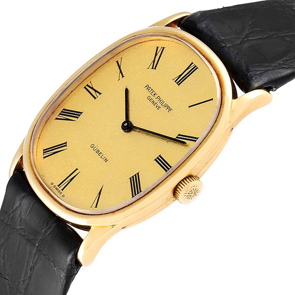 The Patek Philippe Golden Ellipse 3846 Men's Yellow Gold Champagne Dial 3846 Men's Yellow Gold Champagne Dial watch is shown from an angled view, displaying the dial, hands, crown, and part of the strap.