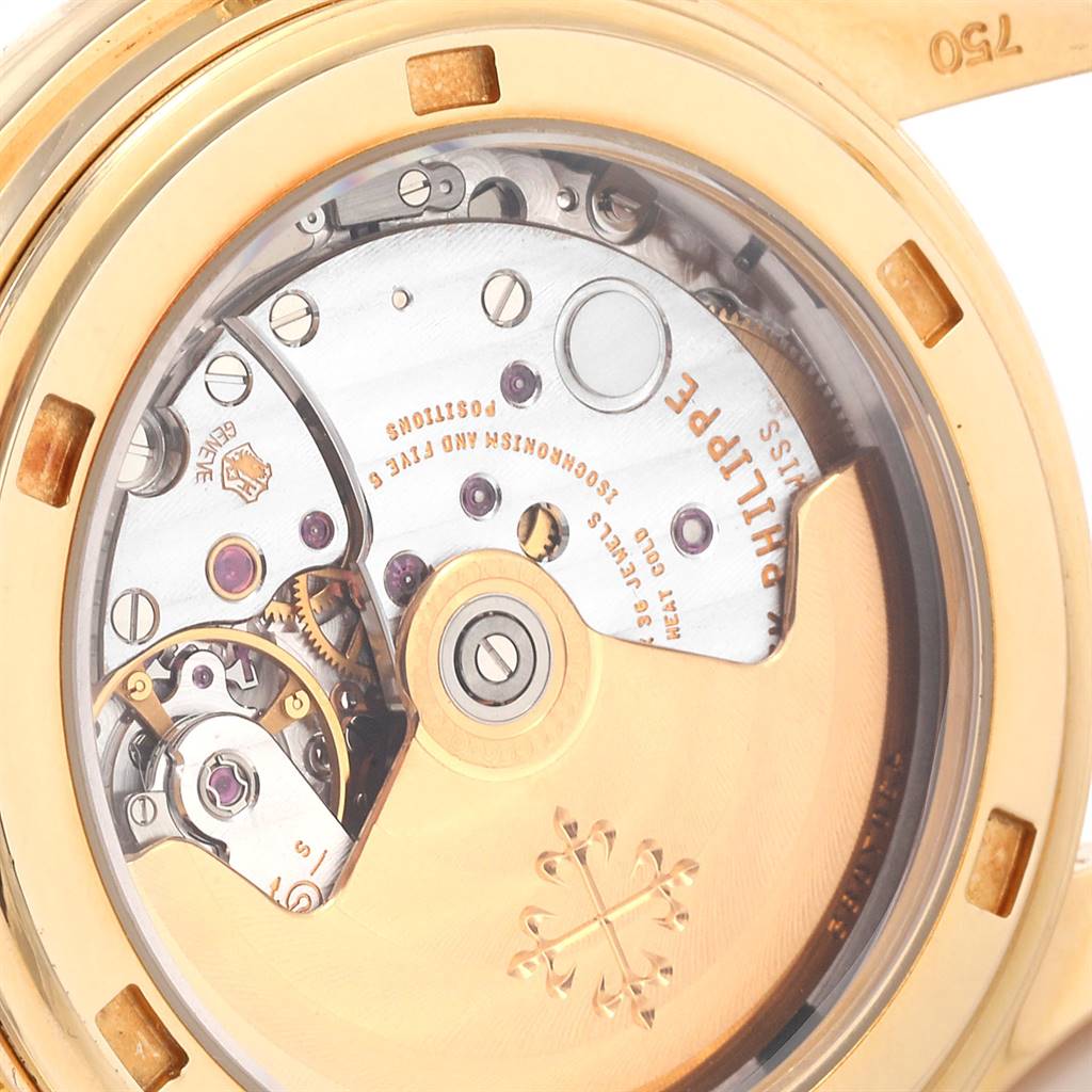 This is a close-up of the movement and inner mechanism of the Patek Philippe 5146J Men's Yellow Gold Beige Dial 5146J Men's Yellow Gold Beige Dial Complicated Annual Calendar Yellow Gold Mens Watch 5146J.
