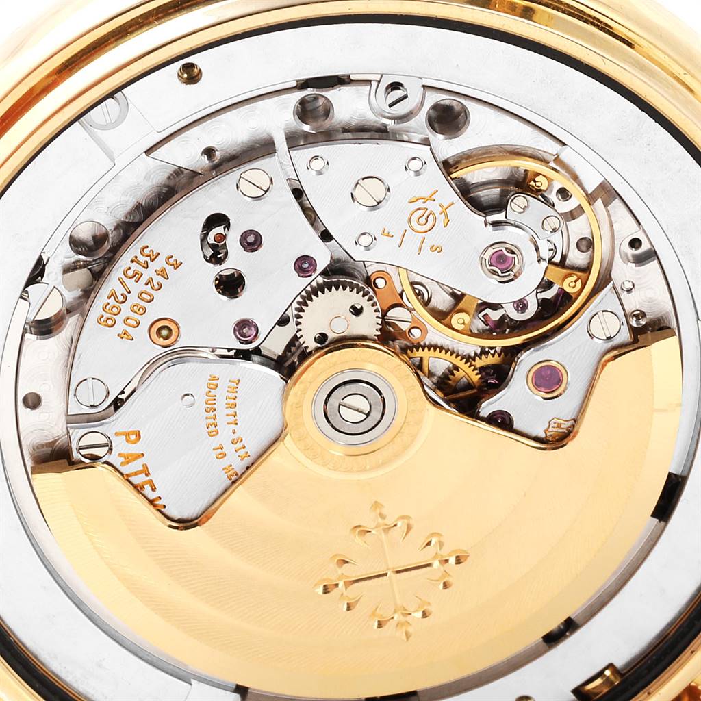 This image shows a detailed close-up view of the movement of the Patek Philippe 5146J Men's Yellow Gold Beige Dial 5146J Men's Yellow Gold Beige Dial Complicated Annual Calendar Yellow Gold Men's Watch 5146J model.
