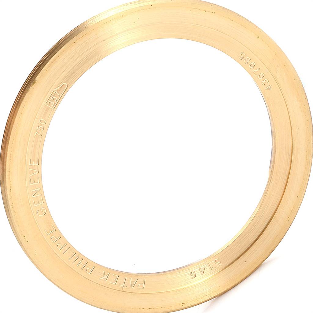 This image shows the yellow gold bezel of a Patek Philippe 5146J Men's Yellow Gold Beige Dial 5146J Men's Yellow Gold Beige Dial Complicated Annual Calendar Mens Watch, model 5146J.