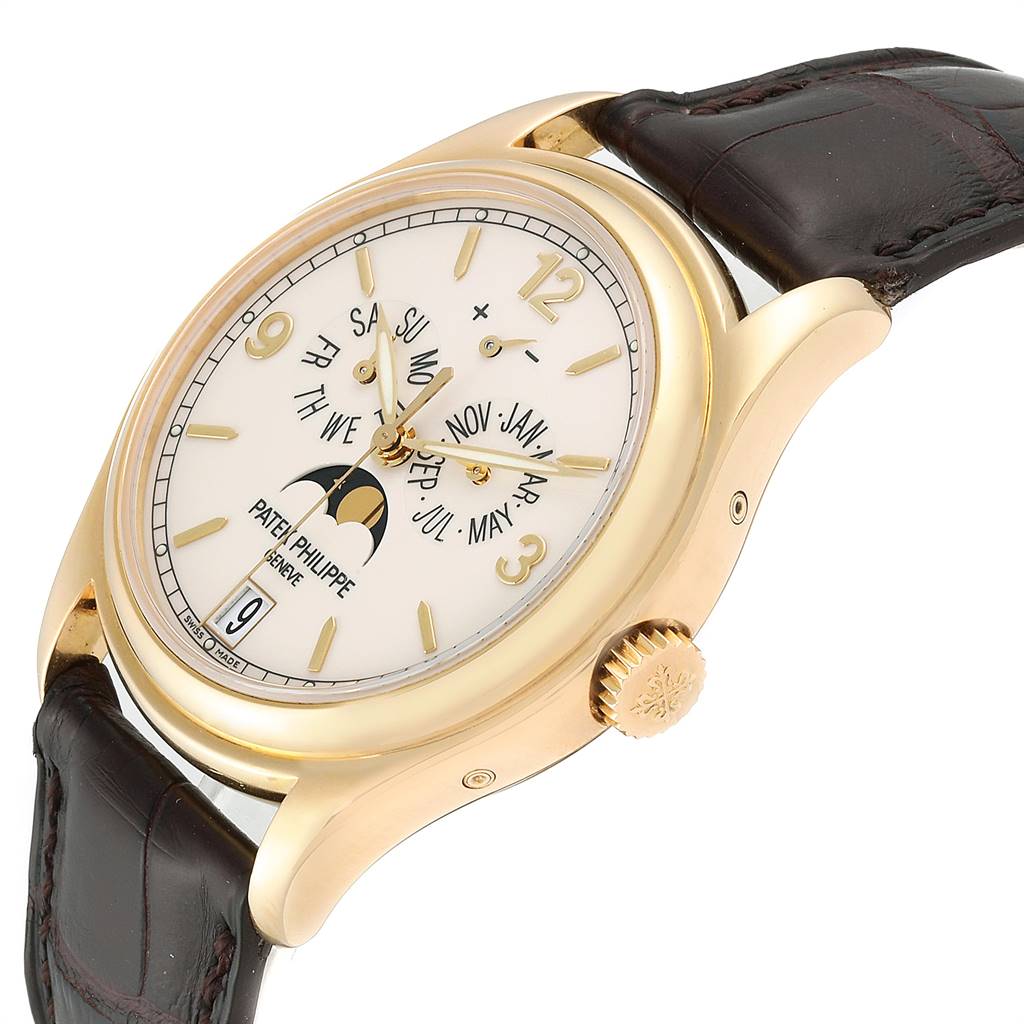 This is a side-angle view of the Patek Philippe 5146J Men's Yellow Gold Beige Dial 5146J Men's Yellow Gold Beige Dial Complicated Annual Calendar Yellow Gold Mens Watch 5146J, showing the watch face, crown, and strap.