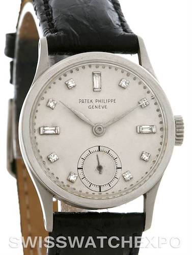 The image shows a front view of a Vintage Patek Philippe watch with a leather strap and diamond markers.
