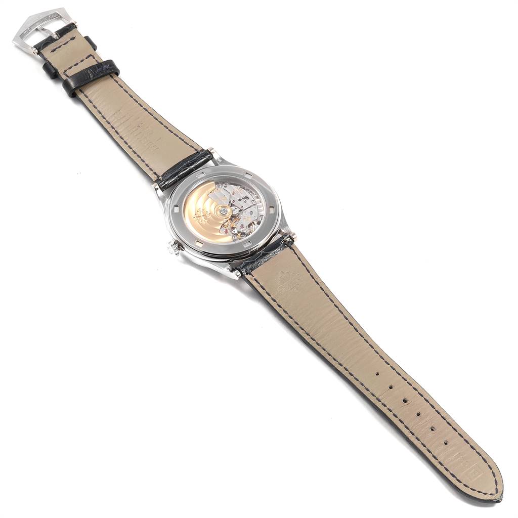 The image shows the back view of a Patek Philippe Calatrava 5296G Men's White Gold Silver Dial 5296G Men's White Gold Silver Dial watch, highlighting the movement and leather strap.