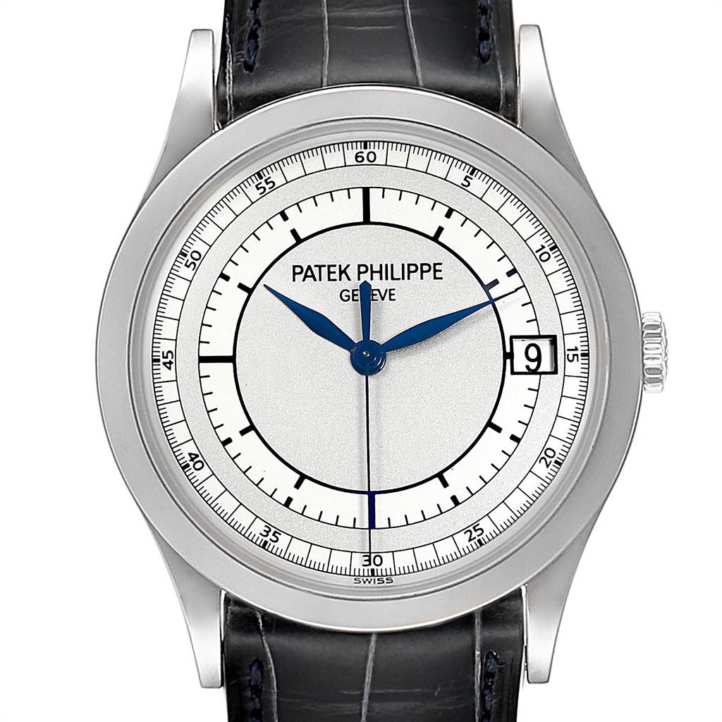 The image shows a front view of a Patek Philippe Calatrava 5296G Men's White Gold Silver Dial 5296G Men's White Gold Silver Dial watch, detailing its dial, hands, case, crown, and part of the leather strap.