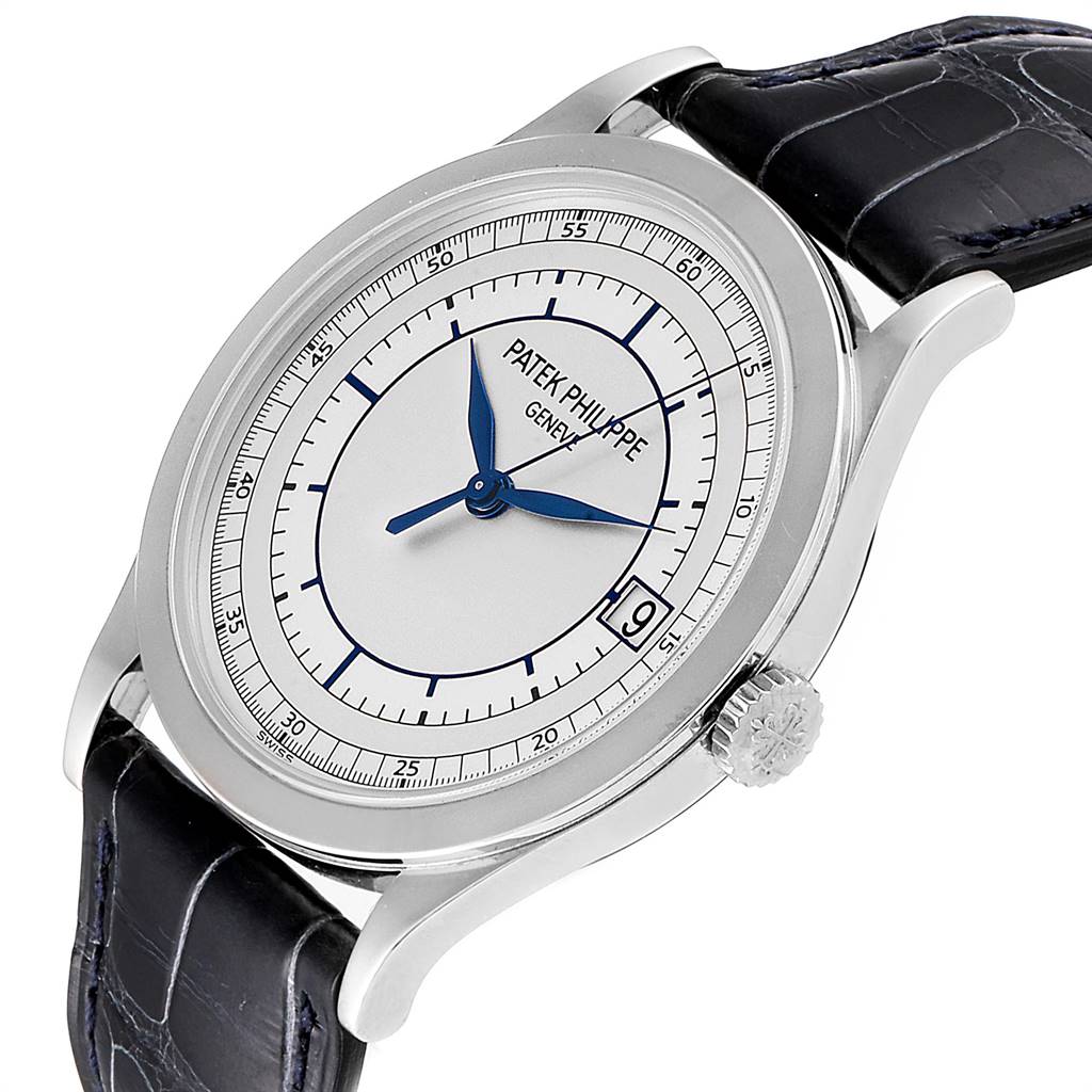 The image shows a Patek Philippe Calatrava 5296G Men's White Gold Silver Dial 5296G Men's White Gold Silver Dial watch at a three-quarter angle, displaying its dial, crown, and strap.