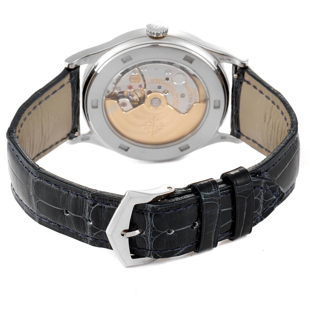 The image shows the back view of a Patek Philippe Calatrava 5296G Men's White Gold Silver Dial 5296G Men's White Gold Silver Dial watch, displaying its buckle and mechanical movement.