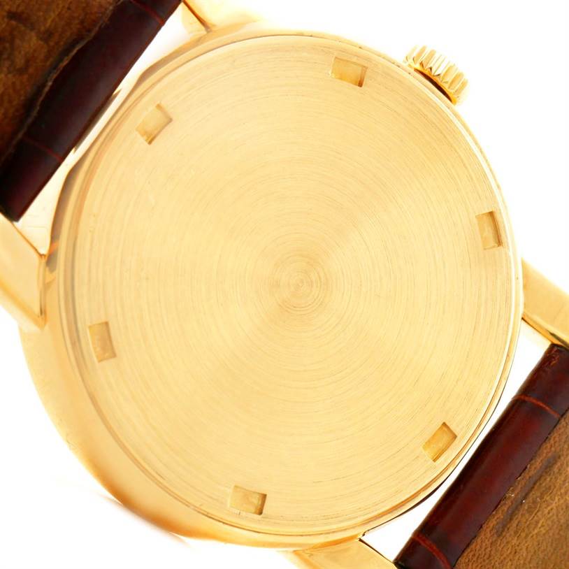This image shows the back case of a Patek Philippe Calatrava 5012 Men's Yellow Gold Beige Dial 5012 Men's Yellow Gold Beige Dial watch from a top-down angle.