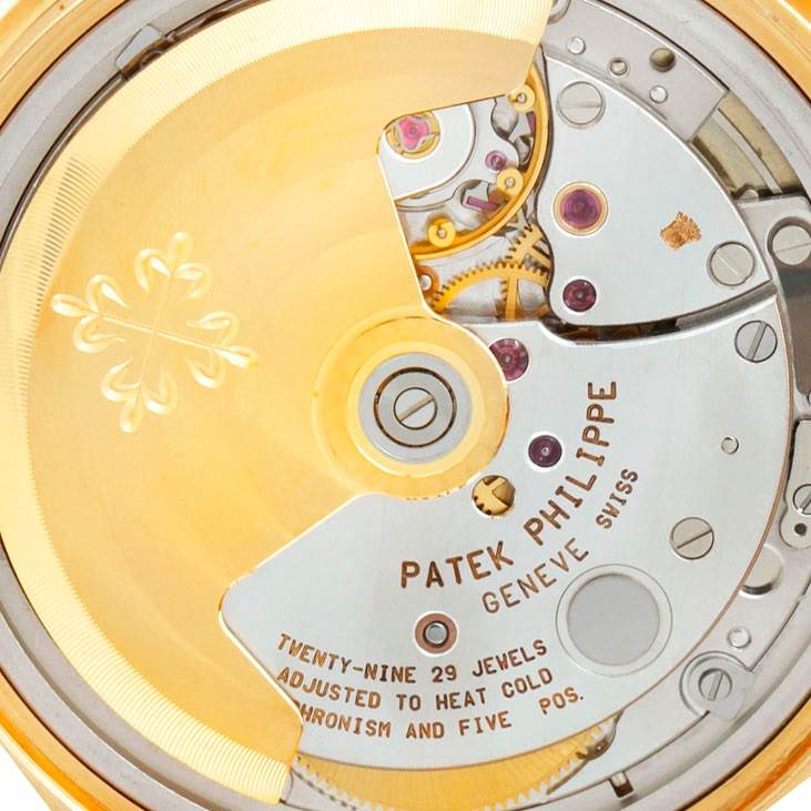 This image shows the intricate rear movement and mechanism of a Patek Philippe Calatrava 5012 Men's Yellow Gold Beige Dial 5012 Men's Yellow Gold Beige Dial watch.