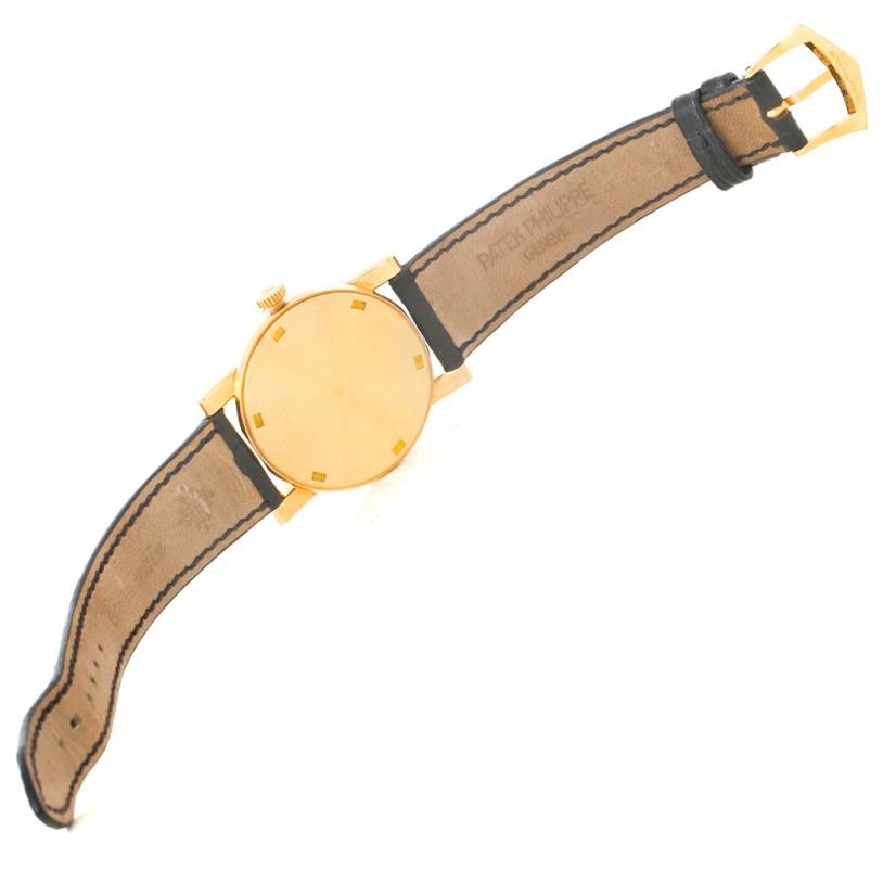 This image shows the back and strap of a Patek Philippe Calatrava 5012 Men's Yellow Gold Beige Dial 5012 Men's Yellow Gold Beige Dial watch at a slight angle.