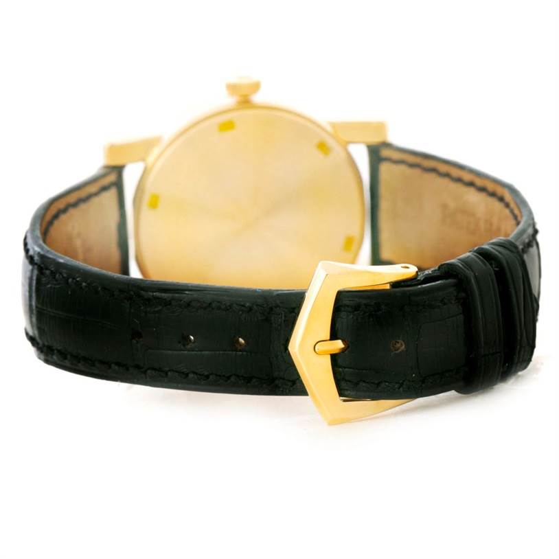 The image shows the backside and strap of a Patek Philippe Calatrava 5012 Men's Yellow Gold Beige Dial 5012 Men's Yellow Gold Beige Dial watch, highlighting the buckle and leather band.