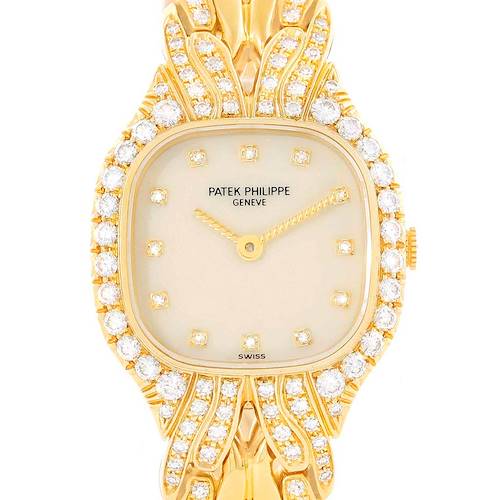 The image shows a front view of a Patek Philippe La Flamme  4815/3 Women's Yellow Gold Beige Dial 4815/3 Women's Yellow Gold Beige Dialwatch, highlighting the face and part of the ornate, diamond-studded band.