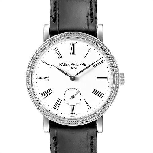 This image shows a front angle of the Patek Philippe Calatrava 7119G Women's White Gold White Dial 7119G Women's White Gold White Dial watch, detailing the face, bezel, and part of the leather strap.