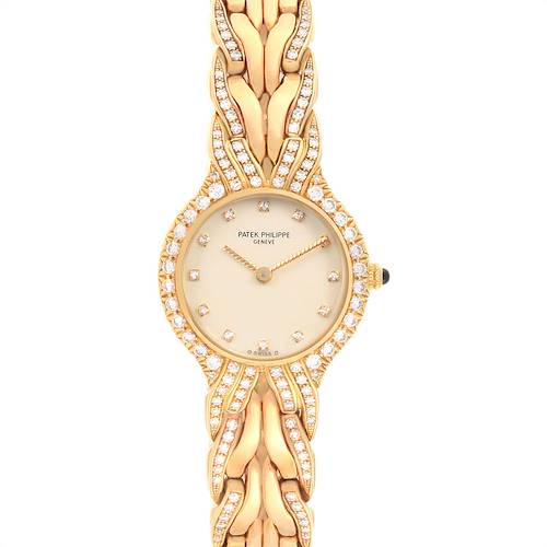 This image shows a top view of the Patek Philippe La Flamme  4816 Women's Yellow Gold Beige Dial 4816 Women's Yellow Gold Beige Dialwatch, highlighting the diamond-studded face and intricate gold bracelet.