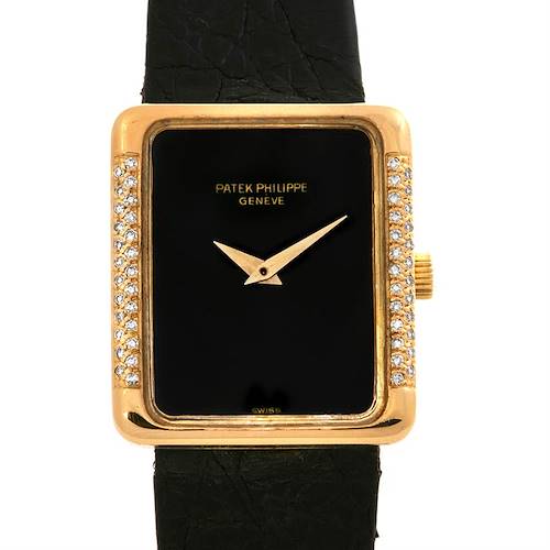 This image shows a front view of the Vintage Patek Philippe watch featuring a rectangular face with a gold bezel and diamond accents.