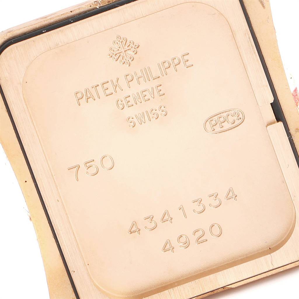This image shows the back of the case of a Patek Philippe Twenty-4 4920R-10 Women's Rose Gold Silver Dial 4920R-10 Women's Rose Gold Silver Dial watch, displaying engravings and markings.
