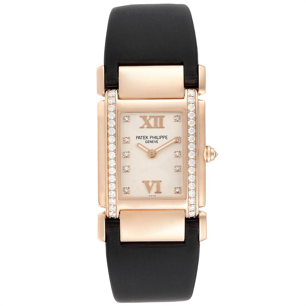The image shows a front view of the Patek Philippe Twenty-4 4920R-10 Women's Rose Gold Silver Dial 4920R-10 Women's Rose Gold Silver Dial watch, highlighting its rectangular dial, diamond accents, and black strap.