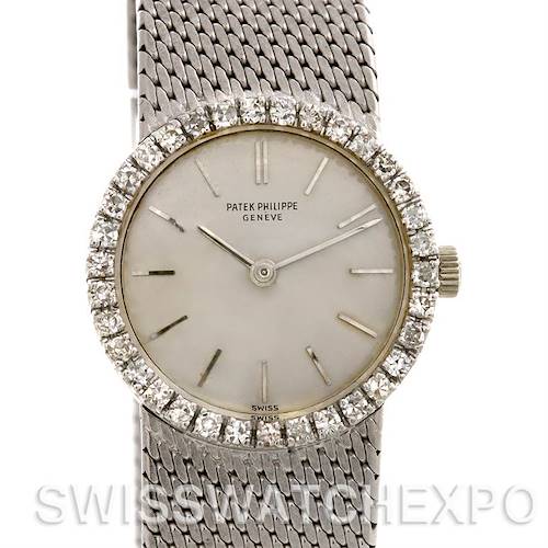 This image shows a frontal view of the Vintage Patek Philippe watch, highlighting the dial, bezel with diamonds, and a woven metal bracelet.