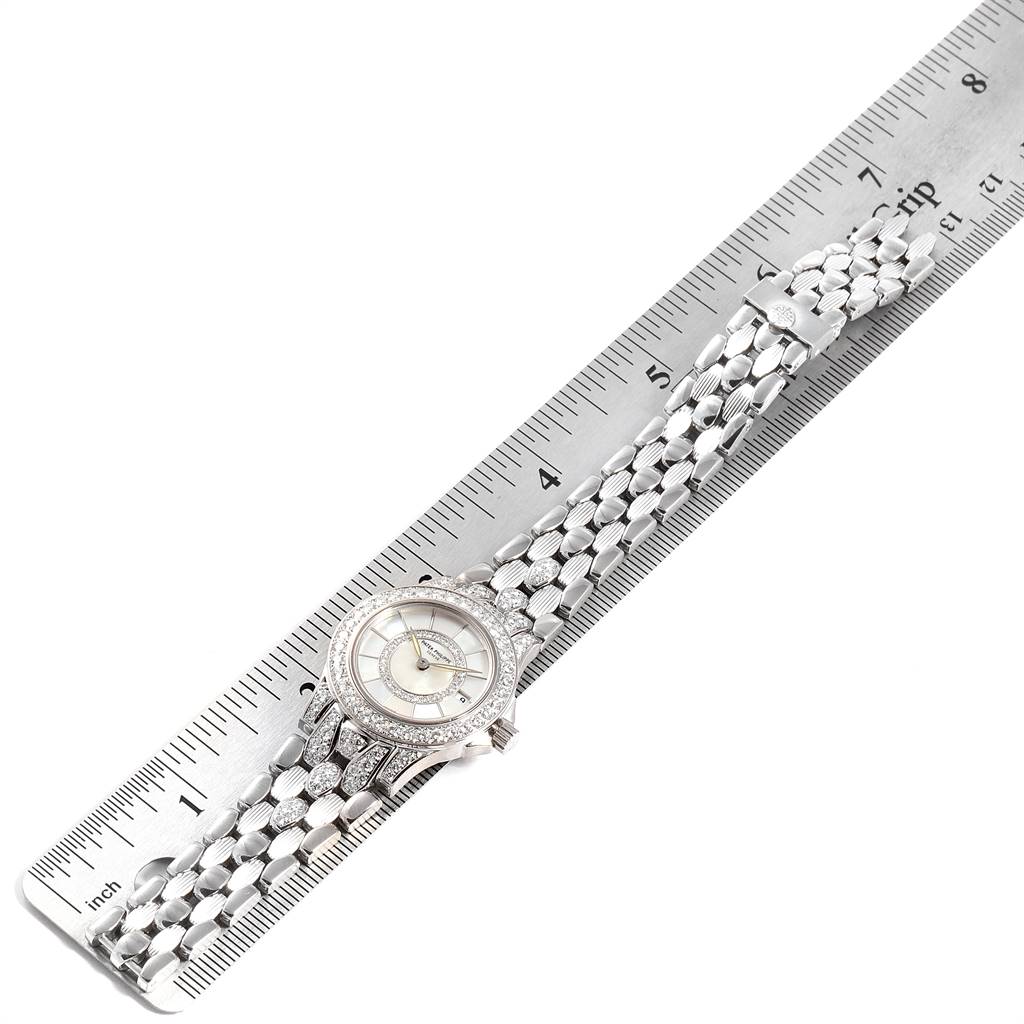 The image shows a Patek Philippe Neptune 4881-120G Women's White Gold Mother of Pearl Dial 4881-120G Women's White Gold Mother of Pearl Dial model watch, displayed flat alongside a measuring ruler.