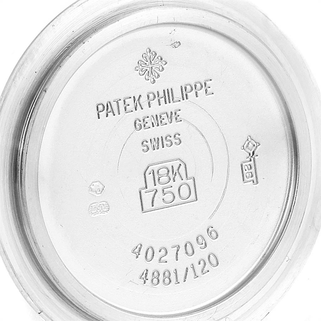 This is the case back of a Patek Philippe Neptune 4881-120G Women's White Gold Mother of Pearl Dial 4881-120G Women's White Gold Mother of Pearl Dial model watch, displaying various engravings and hallmarks.