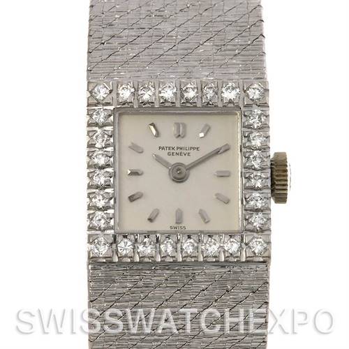 The image shows the face and band of a Vintage Patek Philippe watch, focusing on its diamond-encrusted bezel and textured band.