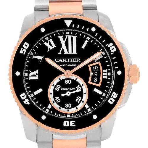 The image shows a front view of the Calibre de Cartier watch by Cartier, highlighting its dial, hands, numeral markers, and bezel.