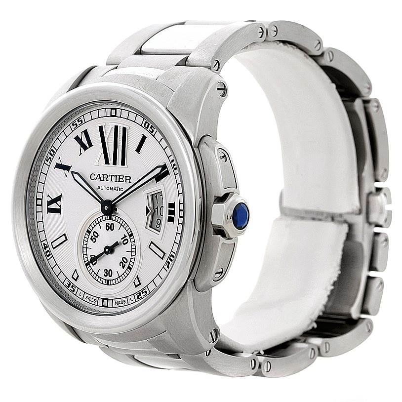 This image shows a side profile and partial front view of a Calibre de Cartier watch by Cartier, including the dial, crown, and bracelet.