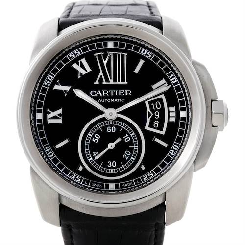 The image shows a front view of the Calibre de Cartier watch by Cartier, displaying its black dial, Roman numerals, and leather strap.