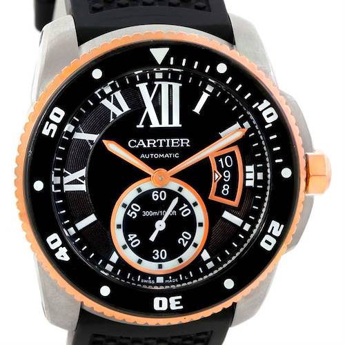 This image shows a close-up view of the Calibre de Cartier model watch by Cartier, focusing on the dial and bezel.