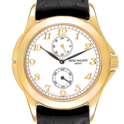 The image shows a front view of a Patek Philippe Calatrava 5134J Men's Yellow Gold White Dial 5134J Men's Yellow Gold White Dial watch, highlighting its dial, hands, subdials, and gold case.