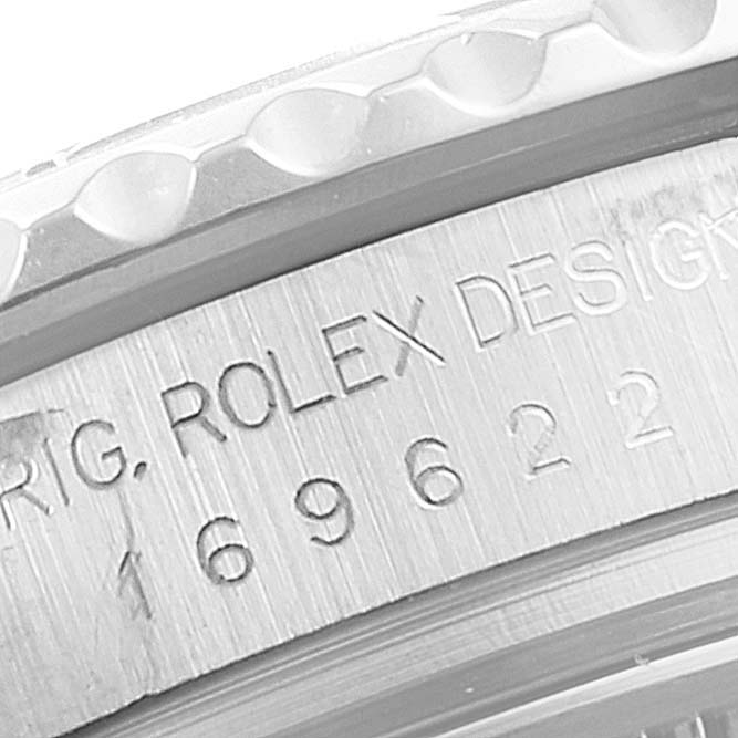 The image shows an engraved section of the bezel and case of a Rolex Yacht-Master 169622 Women's Stainless Steel Silver Dial 169622 Women's Stainless Steel Silver Dial watch.
