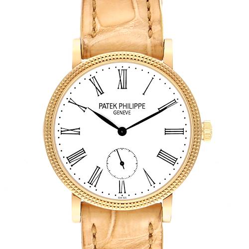 The image shows a front view of the Patek Philippe Calatrava 7119J Women's Yellow Gold White Dial 7119J Women's Yellow Gold White Dial watch, highlighting its white dial, Roman numerals, and beige strap.
