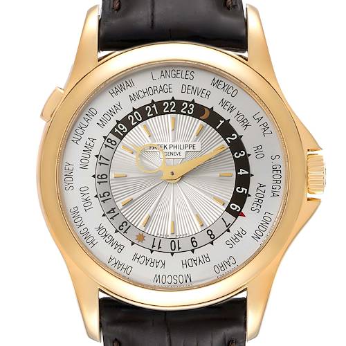 The image shows a frontal view of the Patek Philippe Complications 5130J Men's Yellow Gold Silver Dial 5130J Men's Yellow Gold Silver Dial watch, highlighting its dial with city names and 24-hour display.