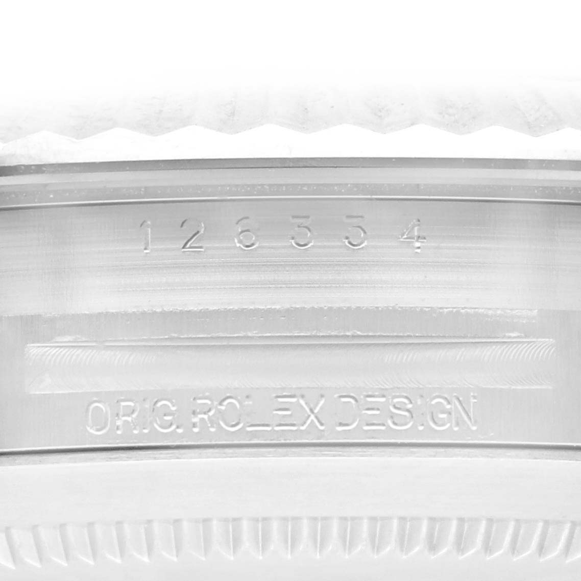 The image shows the side engraving of the case on a Rolex Datejust 41 126334 Men's Stainless Steel Blue Dial 126334 Men's Stainless Steel Blue Dial, featuring the model number and branding.