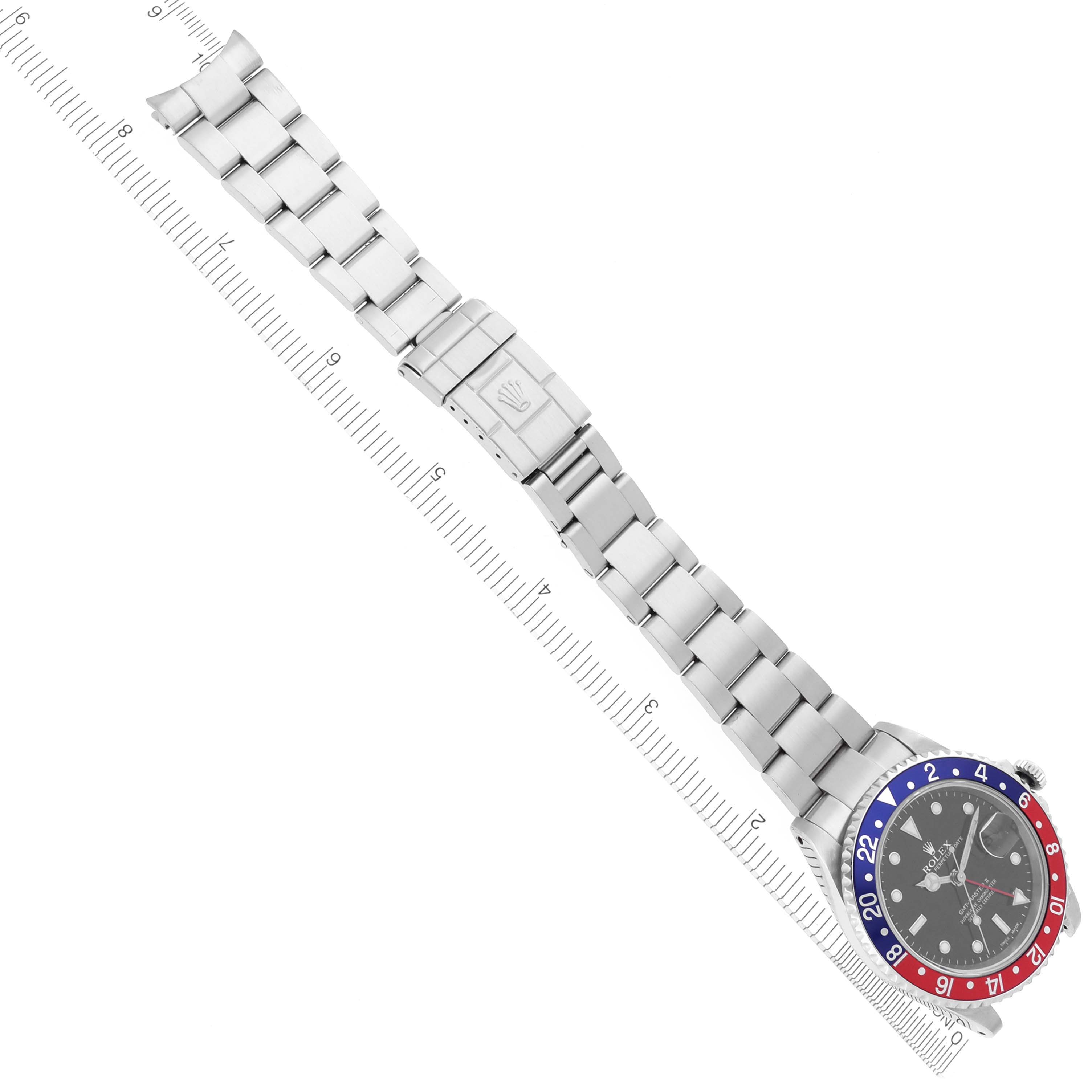 The Rolex GMT-Master 16710 Men's Stainless Steel Black Dial 16710 Men's Stainless Steel Black Dial watch is shown from a top-down angle, displaying its full bracelet and bi-color bezel.