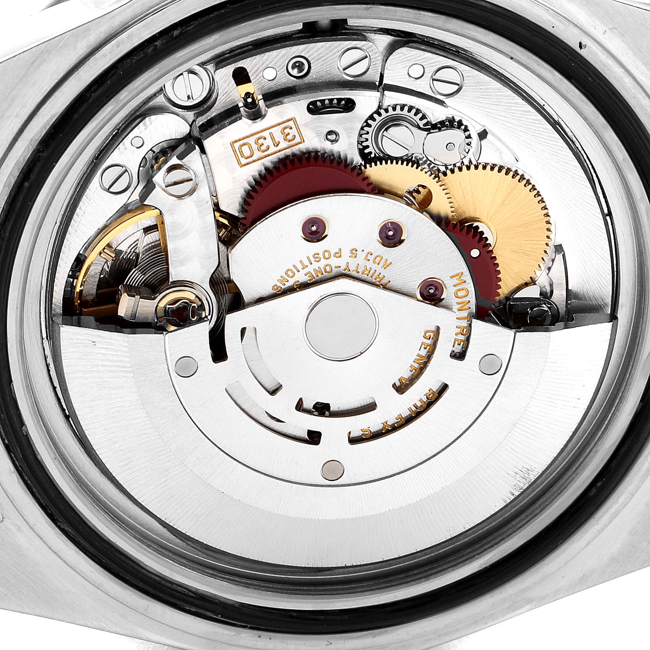 This is a close-up view of the internal movement mechanism of a Rolex Submariner 14060M Men's Stainless Steel Black Dial 14060M Men's Stainless Steel Black Dial watch.