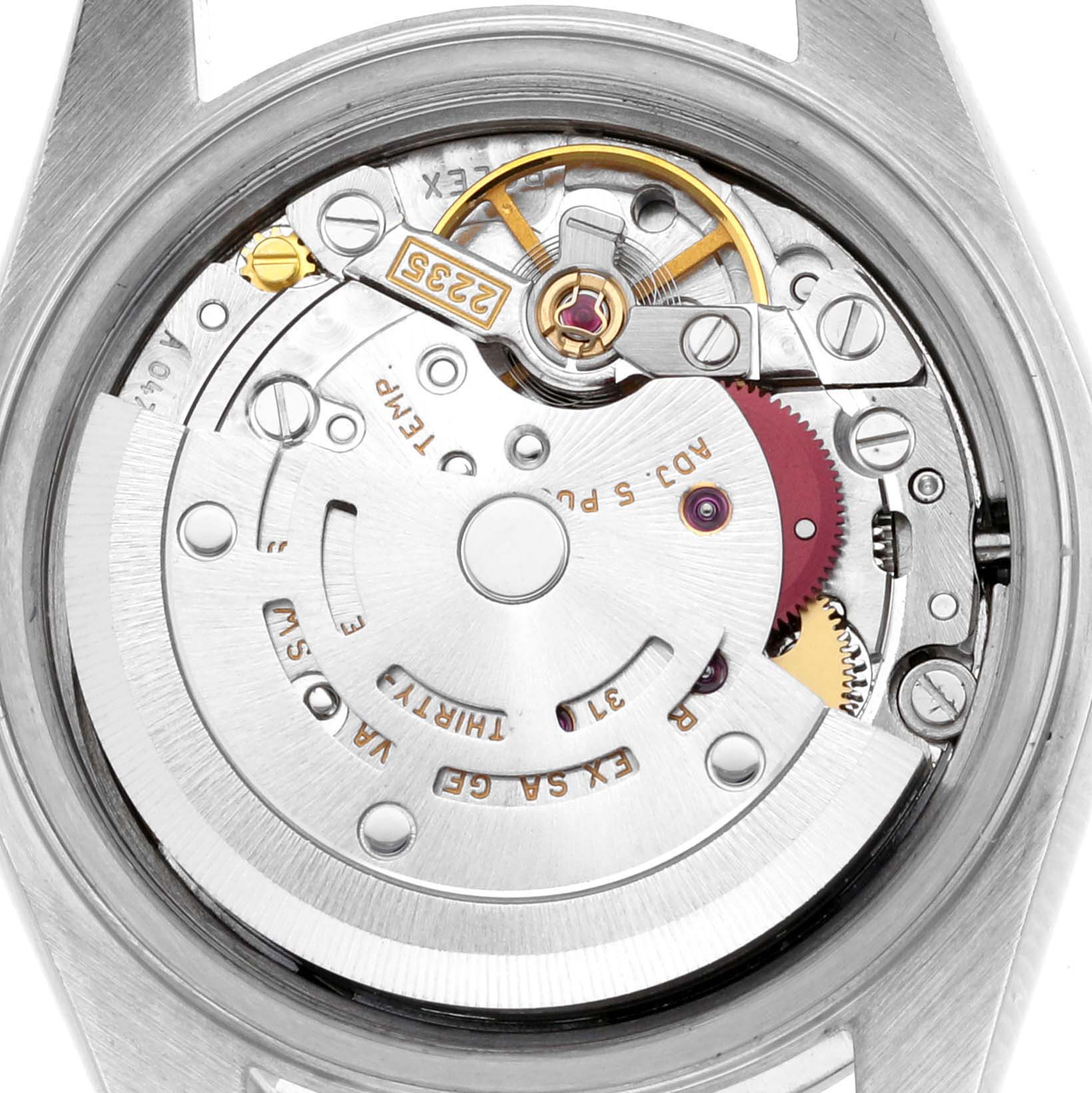 The image shows the movement of a Rolex Date 79160 Women's Stainless Steel Blue Dial 79160 Women's Stainless Steel Blue Dial watch from a top view, revealing components like the rotor and gear train.