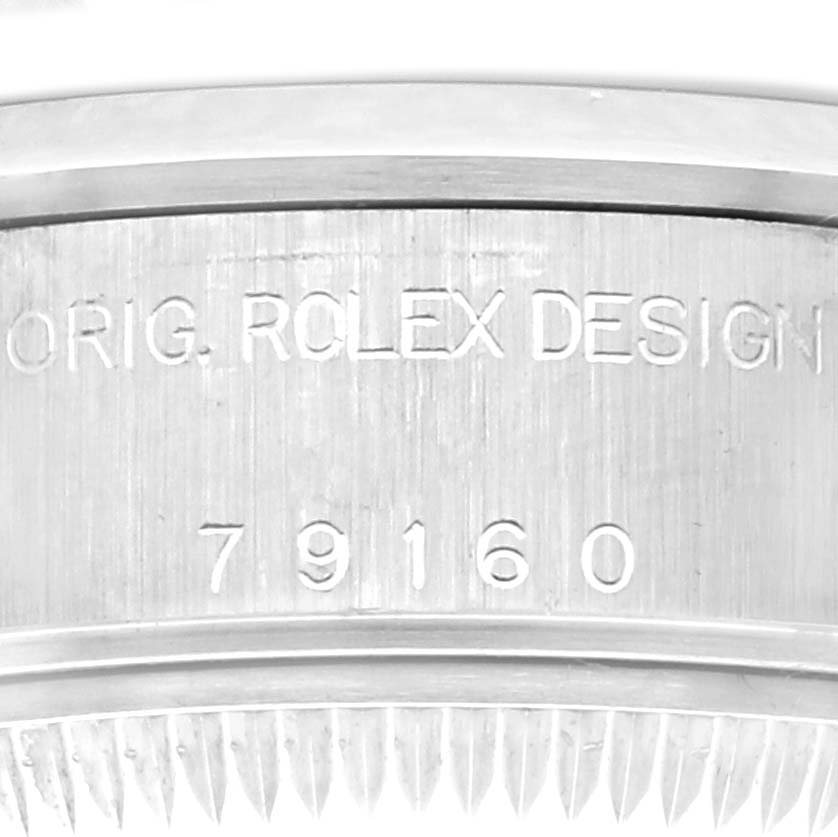 The image shows a close-up of the engraved side of the Rolex Date 79160 Women's Stainless Steel Blue Dial 79160 Women's Stainless Steel Blue Dial model watch, highlighting the "ORIG. ROLEX DESIGN" inscription and model number.