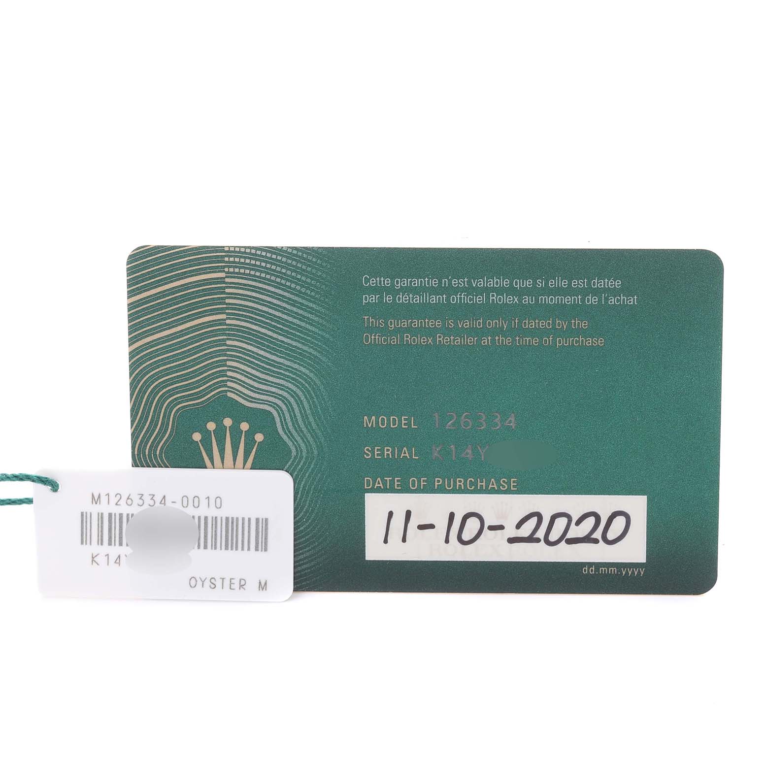 The image shows a Rolex Datejust 41 126334 Men's Stainless Steel Silver Dial 126334 Men's Stainless Steel Silver Dial model warranty card and a tag with model and serial information.