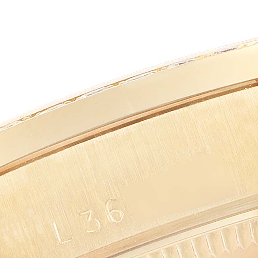 This is a close-up view of the outer edge and engraved serial number of a Rolex President 68288 Women's White Gold Champagne Dial 68288 Women's White Gold Champagne Dial watch.