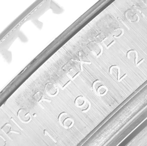 The image shows a close-up of the engraving on the side of a Rolex Yacht-Master 169622 Women's Stainless Steel Silver Dial 169622 Women's Stainless Steel Silver Dial watch, displaying part of the serial number and design markings.