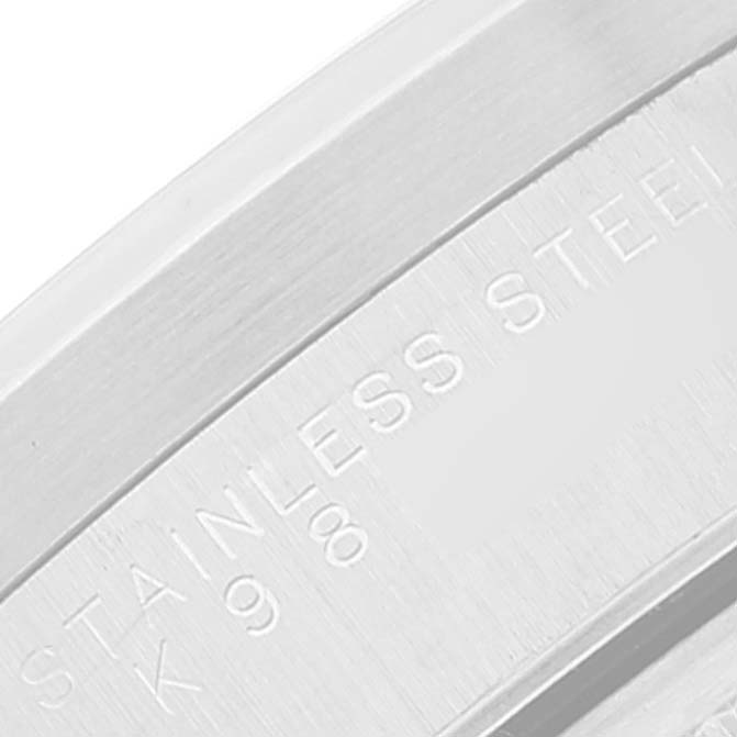 The image shows a close-up of the stainless steel case back of a Rolex Date 15210 Men's Stainless Steel Blue Dial 15210 Men's Stainless Steel Blue Dial model watch.