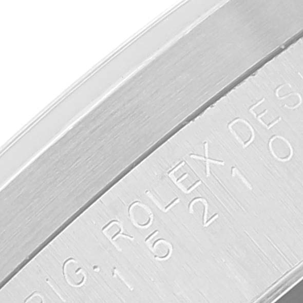 The image shows a close-up of the engraved bezel of a Rolex Date 15210 Men's Stainless Steel Blue Dial 15210 Men's Stainless Steel Blue Dial model watch.