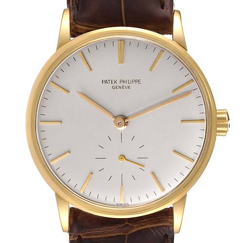 The image shows a front view of a Patek Philippe Calatrava 3425 Men's Yellow Gold Silver Dial 3425 Men's Yellow Gold Silver Dial watch displaying its dial, hands, and part of the strap.
