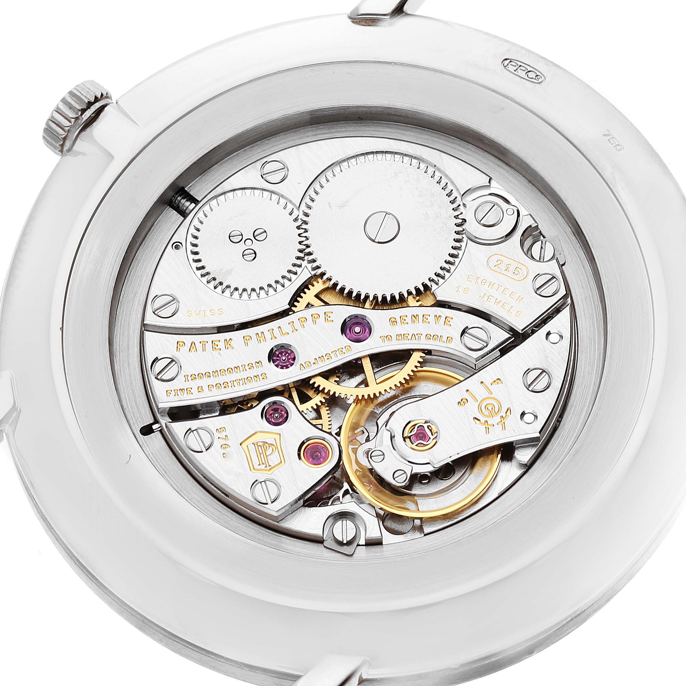 This image shows the intricate mechanical movement of the Patek Philippe Calatrava 5119G-001 Men's White Gold White Dial 5119G-001 Men's White Gold White Dial watch from a close-up, internal angle.