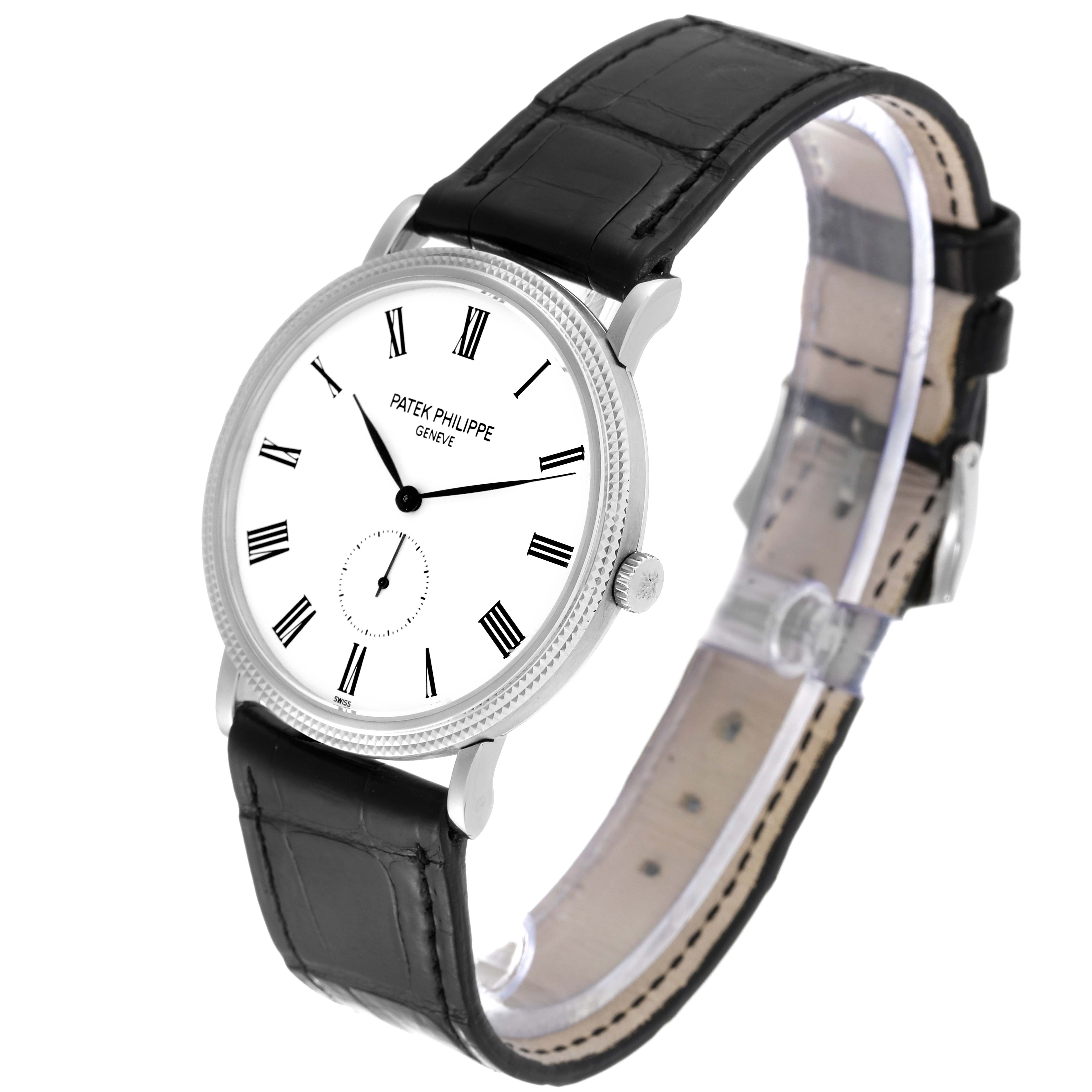 The Patek Philippe Calatrava 5119G-001 Men's White Gold White Dial 5119G-001 Men's White Gold White Dial watch is shown at a slight angle, displaying its face, crown, and black leather strap.