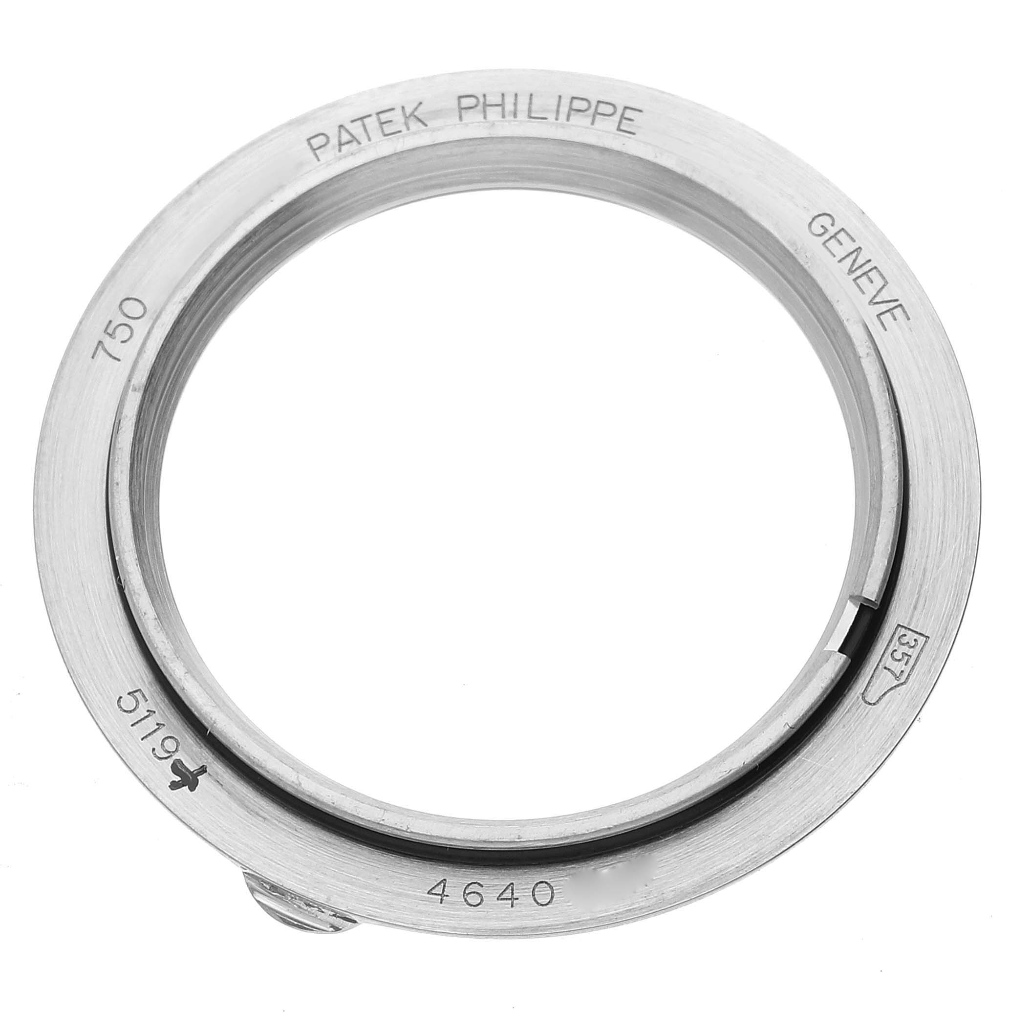 This image shows a top-down view of the Patek Philippe Calatrava 5119G-001 Men's White Gold White Dial 5119G-001 Men's White Gold White Dial watch bezel with engraved markings.