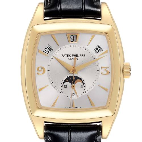 The Patek Philippe Gondolo 5135J-001 Men's Yellow Gold Silver Dial 5135J-001 Men's Yellow Gold Silver Dial watch is shown from a front angle featuring its face, gold case, and black leather strap.